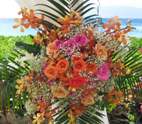 Clcse up of flower arrangement on bamboo canopy chuppah