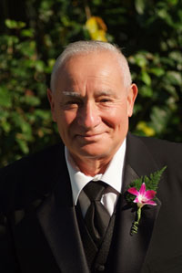 Orchid boutonniere on wedding party member