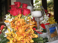 Orchids, flowers and floating candles at a Maui wedding reception