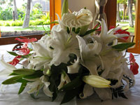 Maui wedding reception centerpiece with lillies and Anthuriums