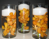 Floating candle centerpieces with orchids